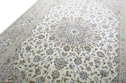 Backside of handmade 2000s Kashan rug showing knot structure and weave density