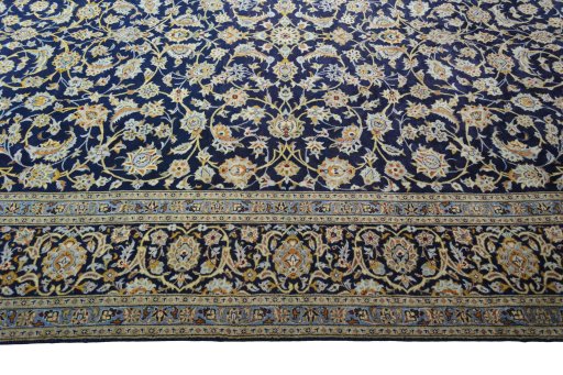 Corner detail of 2000s Kashan rug showing border pattern and Wool pile