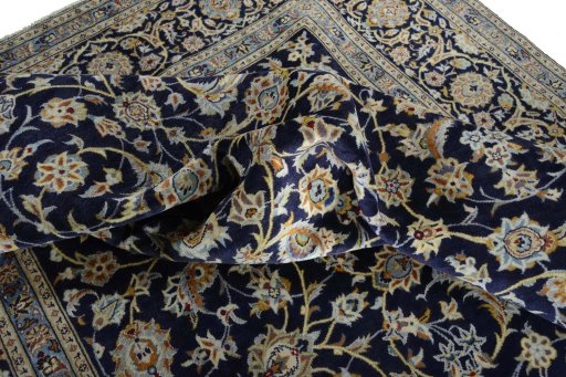 Surface texture of 2000s Kashan rug with natural Wool and intricate pattern