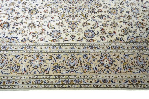 Corner detail of New Kashan rug showing border pattern and Wool pile