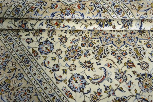 Close-up detail of New Kashan rug from Iran / Persia showing Wool weave