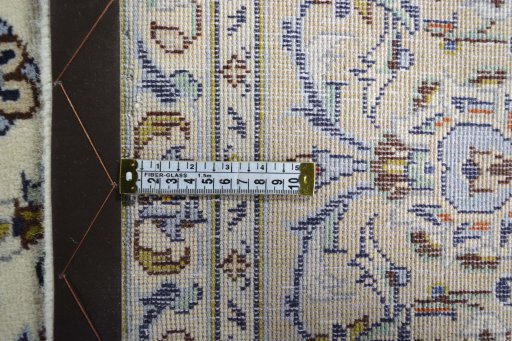 Backside of handmade New Kashan rug showing knot structure and weave density