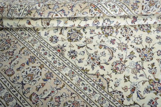 Close-up detail of 2000s Kashan rug from Iran / Persia showing Wool weave