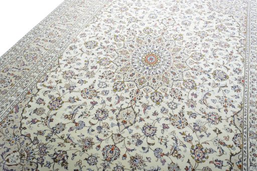Backside of handmade 2000s Kashan rug showing knot structure and weave density