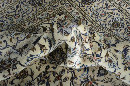 Surface texture of 2000s Kashan rug with natural Wool and intricate pattern