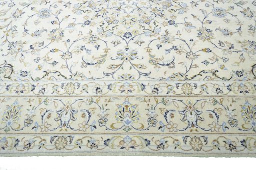 Corner detail of New Kashan rug showing border pattern and Wool pile