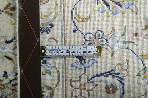 Backside of handmade New Kashan rug showing knot structure and weave density