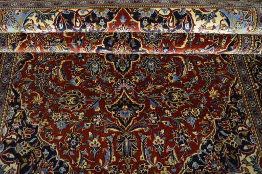Close-up detail of 2000s Kashan rug from Iran / Persia showing Cork weave