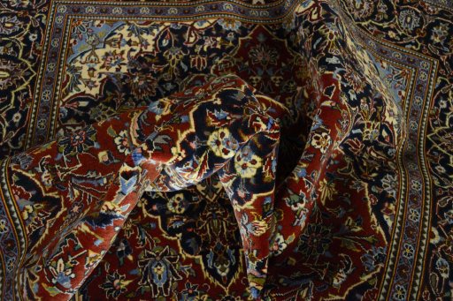 Surface texture of 2000s Kashan rug with natural Cork and intricate pattern