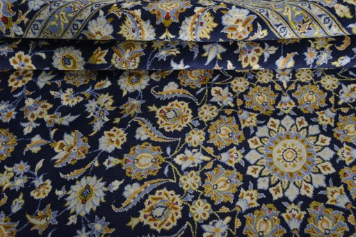 Close-up detail of 2000s Kashan rug from Iran / Persia showing Wool weave