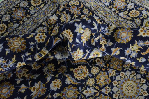 Surface texture of 2000s Kashan rug with natural Wool and intricate pattern