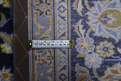 Backside of handmade 2000s Kashan rug showing knot structure and weave density