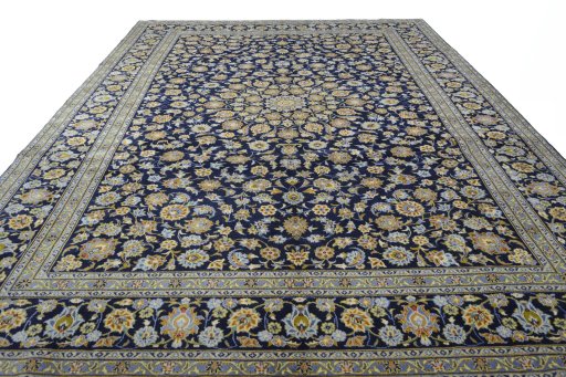 Surface texture of 2000s Kashan rug with natural Wool and intricate pattern