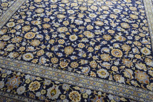 Close-up detail of 2000s Kashan rug from Iran / Persia showing Wool weave