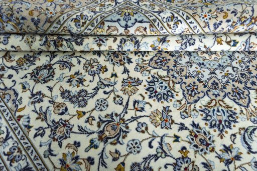 Close-up detail of 2000s Kashan rug from Iran / Persia showing Wool weave