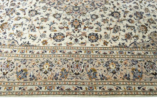 Corner detail of 2000s Kashan rug showing border pattern and Wool pile
