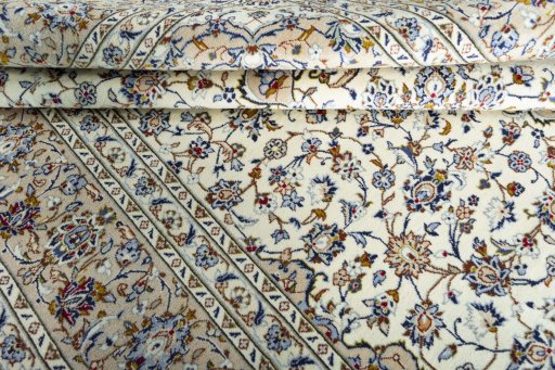 Close-up detail of 2000s Kashan rug from Iran / Persia showing Wool weave