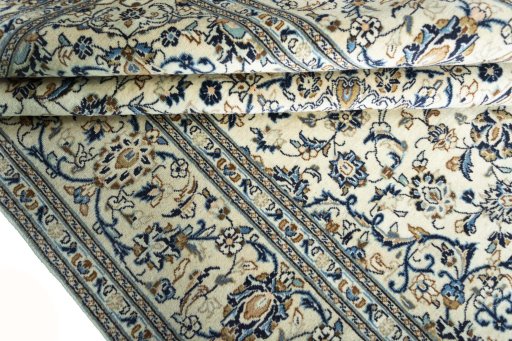 Close-up detail of 2000s Kashan rug from Iran / Persia showing Wool weave