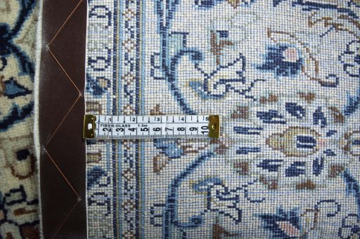 Backside of handmade 2000s Kashan rug showing knot structure and weave density
