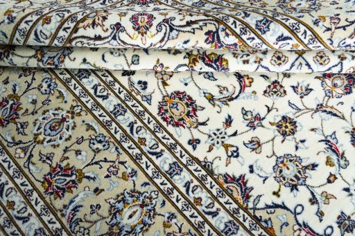 Close-up detail of 2000s Kashan rug from Iran / Persia showing Wool weave