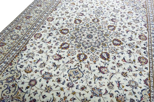Backside of handmade 2000s Kashan rug showing knot structure and weave density