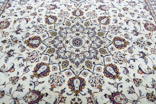 Central medallion detail of 2000s Kashan rug from Iran / Persia