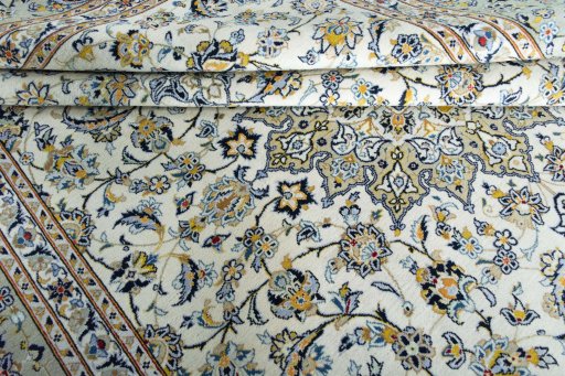 Close-up detail of 2000s Kashan rug from Iran / Persia showing Wool weave