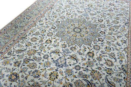 Backside of handmade 2000s Kashan rug showing knot structure and weave density