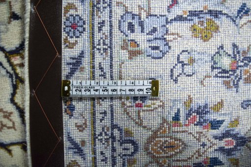 Surface texture of 2000s Kashan rug with natural Wool and intricate pattern