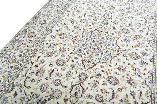 Backside of handmade 2000s Kashan rug showing knot structure and weave density