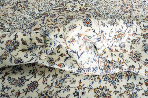Surface texture of 2000s Kashan rug with natural Wool and intricate pattern