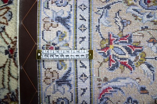 Backside of handmade 2000s Kashan rug showing knot structure and weave density