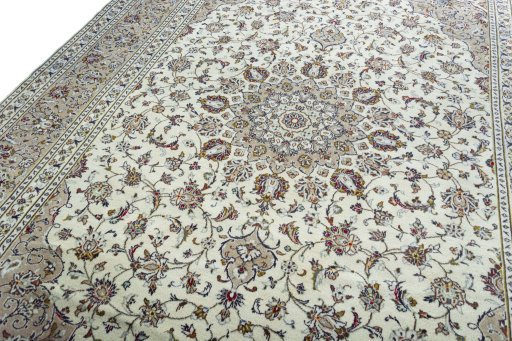Backside of handmade 2000s Kashan rug showing knot structure and weave density
