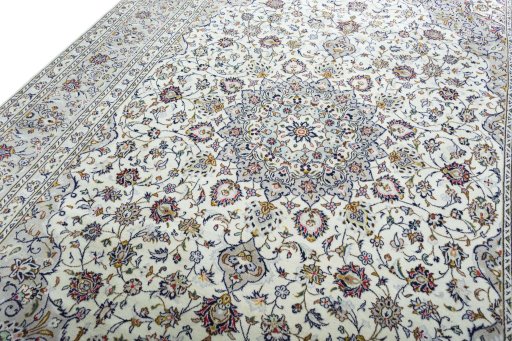 Backside of handmade 2000s Kashan rug showing knot structure and weave density