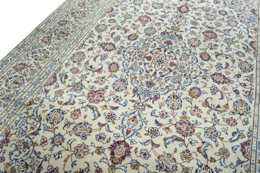 Backside of handmade 2000s Kashan rug showing knot structure and weave density