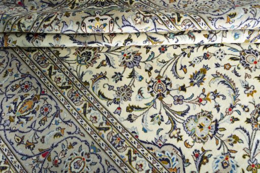 Close-up detail of 2000s Kashan rug from Iran / Persia showing Wool weave