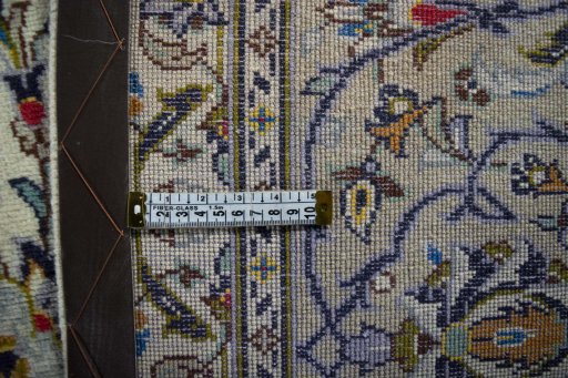 Backside of handmade 2000s Kashan rug showing knot structure and weave density