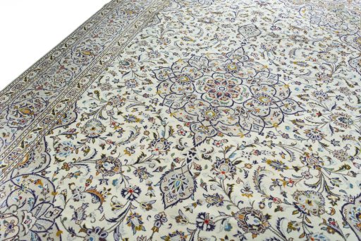 Backside of handmade 2000s Kashan rug showing knot structure and weave density