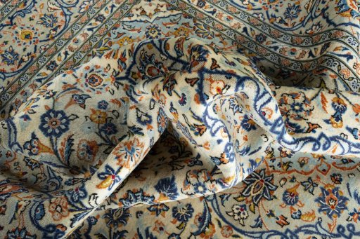 Surface texture of 2000s Kashan rug with natural Wool and intricate pattern