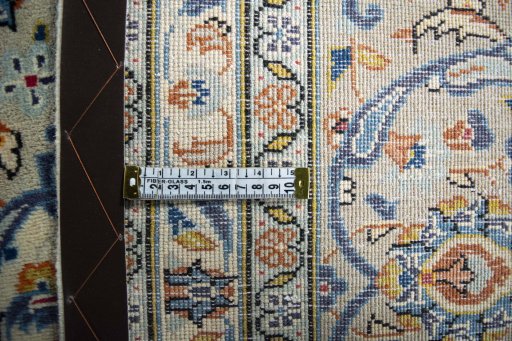 Backside of handmade 2000s Kashan rug showing knot structure and weave density
