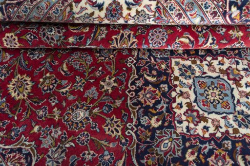 Close-up detail of 2000s Kashan rug from Iran / Persia showing Wool weave