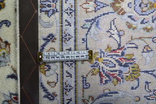 Backside of handmade 2000s Kashan rug showing knot structure and weave density