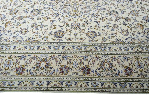 Corner detail of 2000s Kashan rug showing border pattern and Wool pile