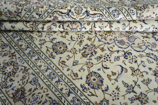 Close-up detail of 2000s Kashan rug from Iran / Persia showing Wool weave