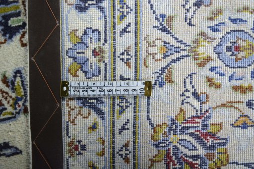 Backside of handmade 2000s Kashan rug showing knot structure and weave density