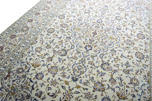 Backside of handmade 2000s Kashan rug showing knot structure and weave density