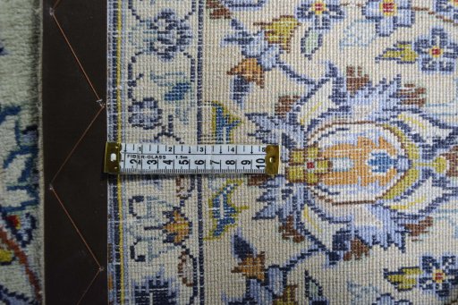 Backside of handmade 2000s Kashan rug showing knot structure and weave density