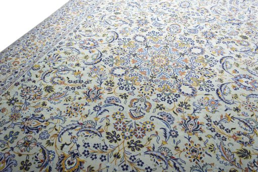 Backside of handmade 2000s Kashan rug showing knot structure and weave density