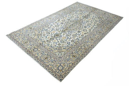 Corner detail of 2000s Kashan rug showing border pattern and Wool pile