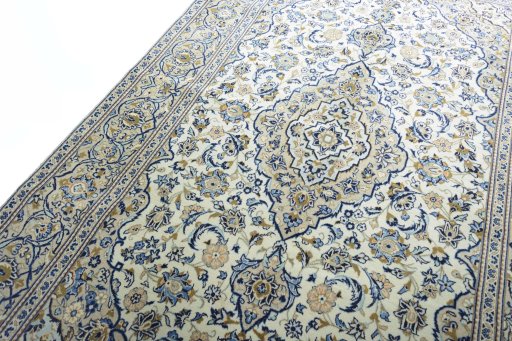Backside of handmade 2000s Kashan rug showing knot structure and weave density